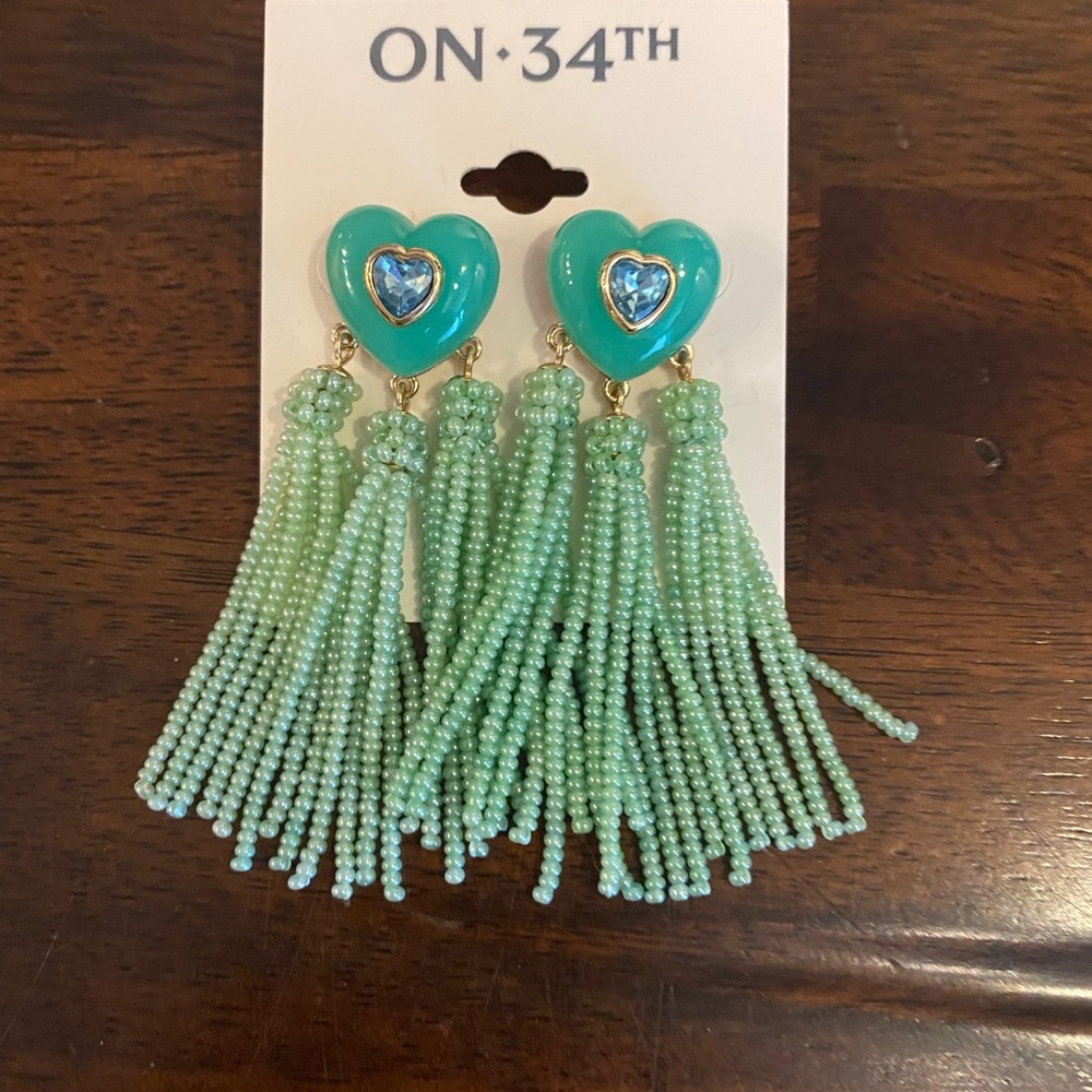 On 34th green heart dangle earrings